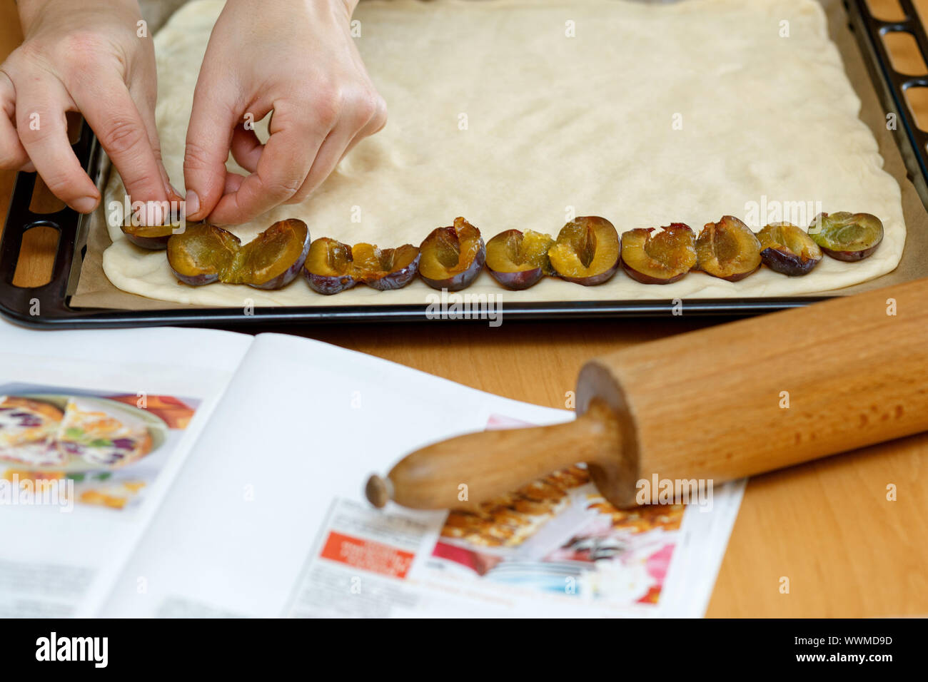 preparing, baking plum cake Stock Photo