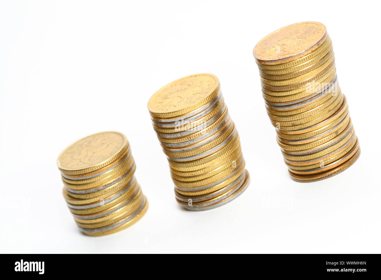 coins piles isolated on white background Stock Photo - Alamy