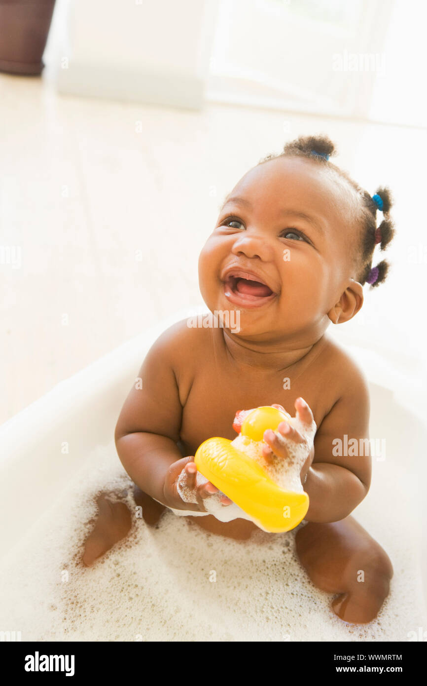 Baby in bubble bath Stock Photo Alamy