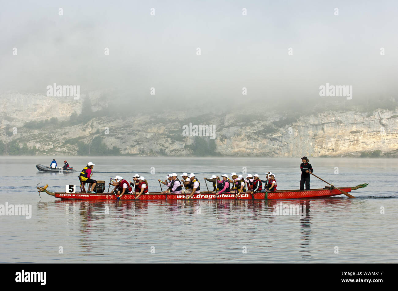 Crew in dragon boat on the lake Lac de Joux Stock Photo