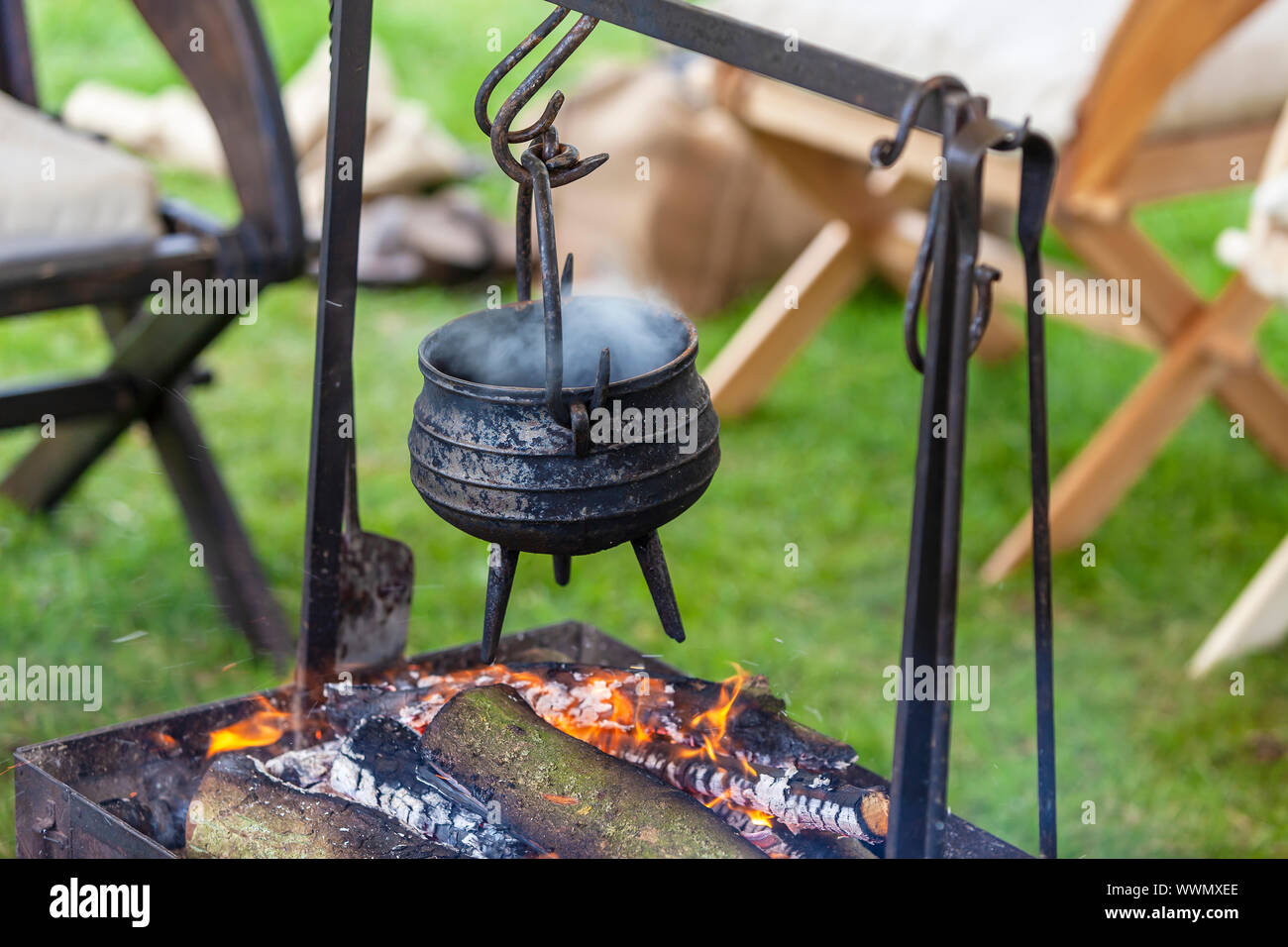 Outdoor cooking pot hanging over hires stock photography and images