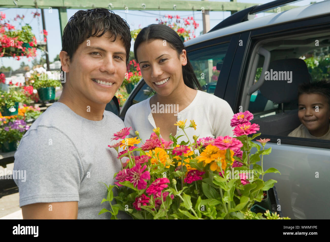 Couple Loading Plants into Minivan Stock Photo