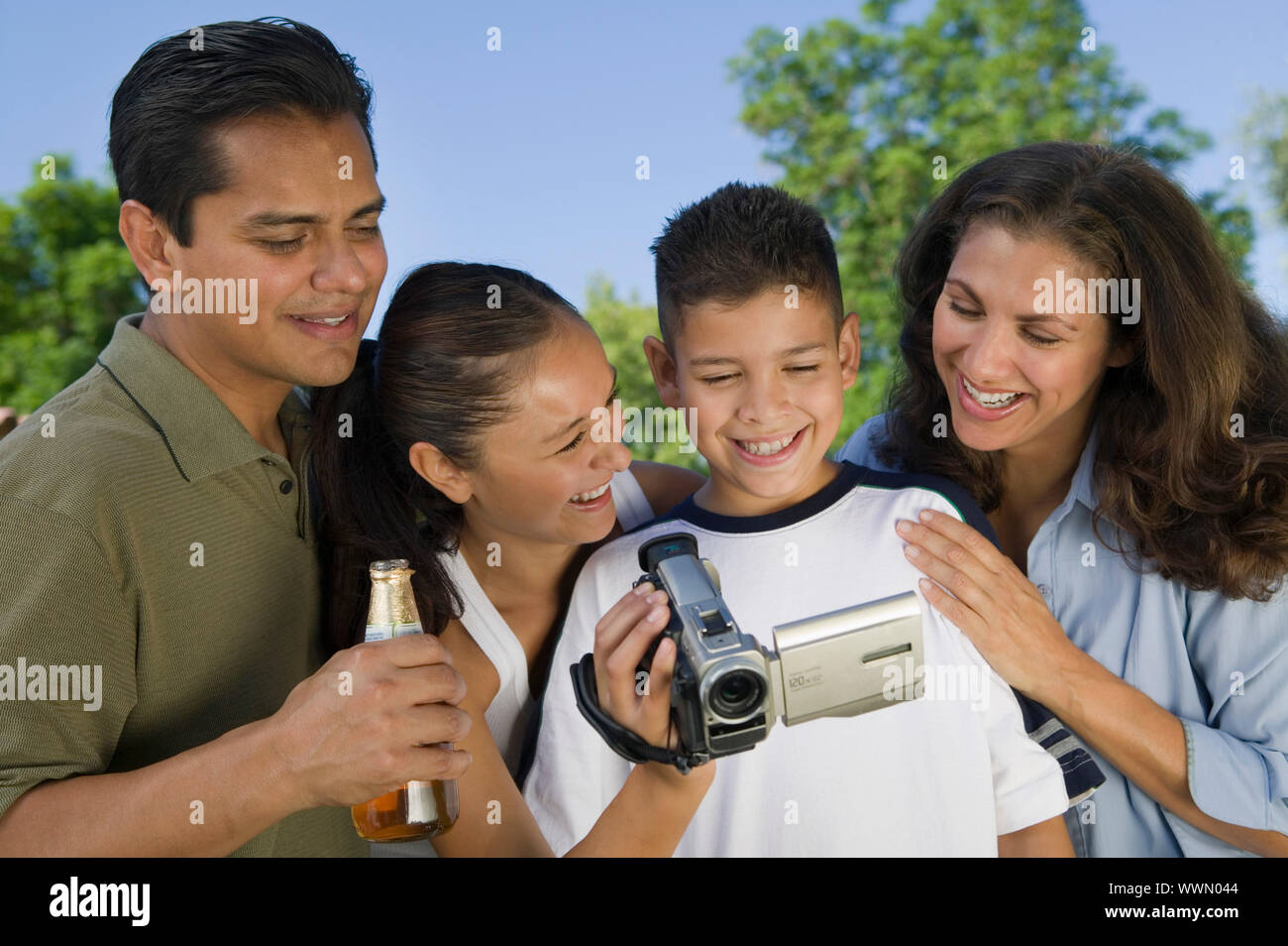 Family Watching Video Camera Stock Photo