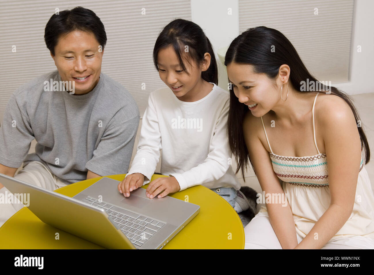 Family Using Laptop Stock Photo
