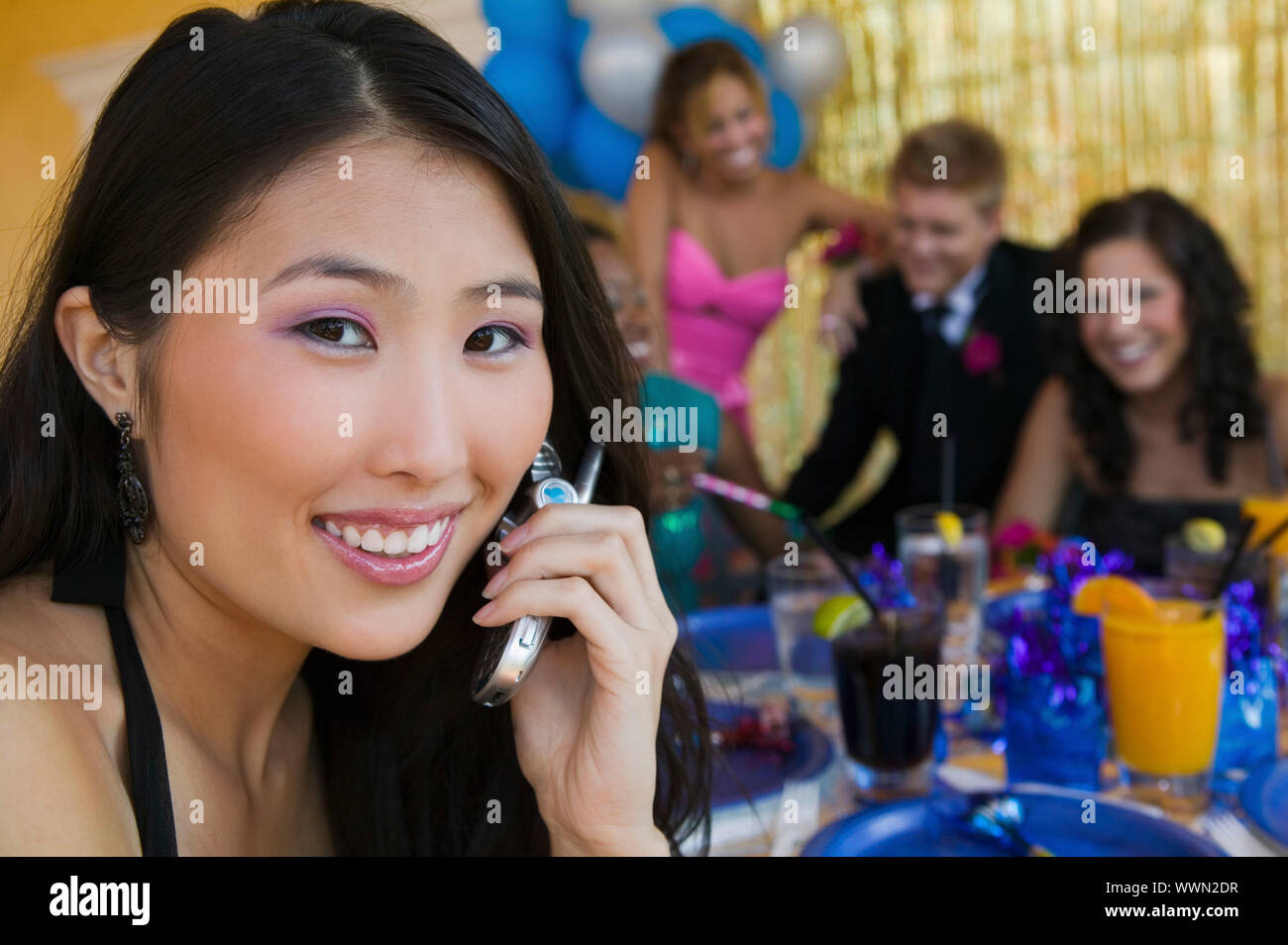 Teenage Girl at Party Using Cell Phone Stock Photo Alamy
