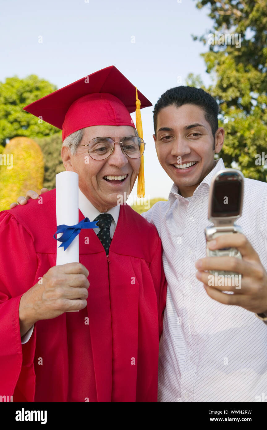 Graduates taking picture cell hi-res stock photography and images - Alamy