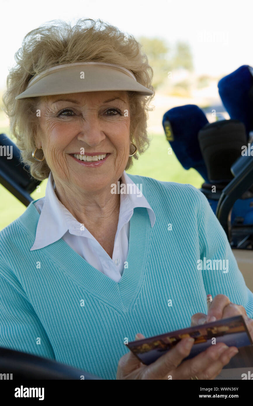 Smiling Golfer with Scorecard Stock Photo