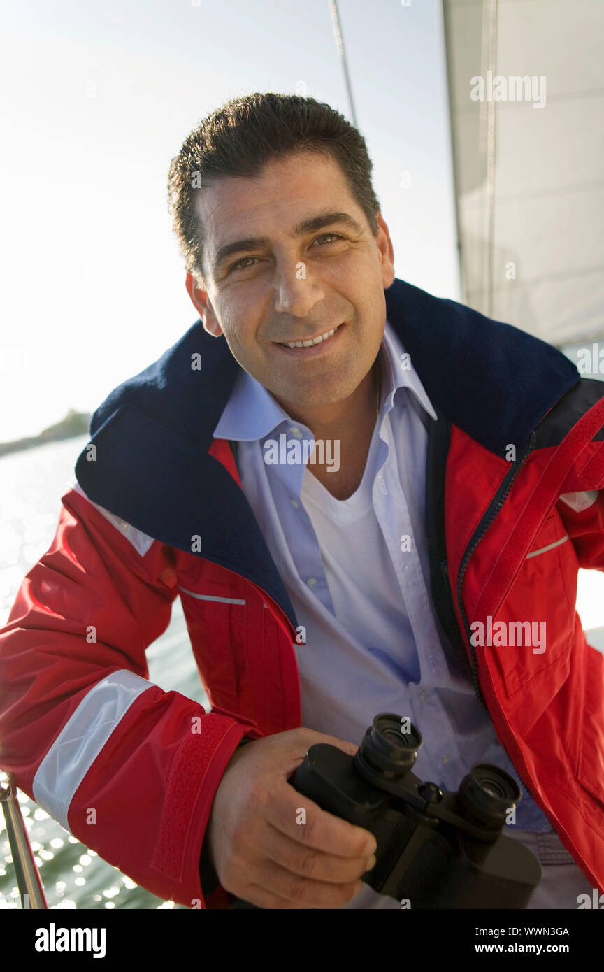 Men on Boat with Binoculars Stock Photo Alamy