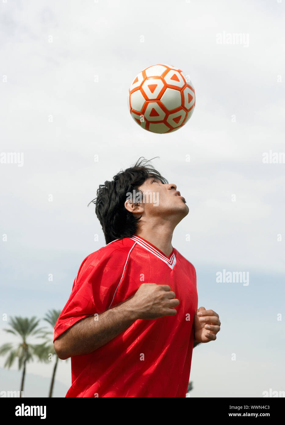 Soccer Player Heading Ball Stock Photo Alamy