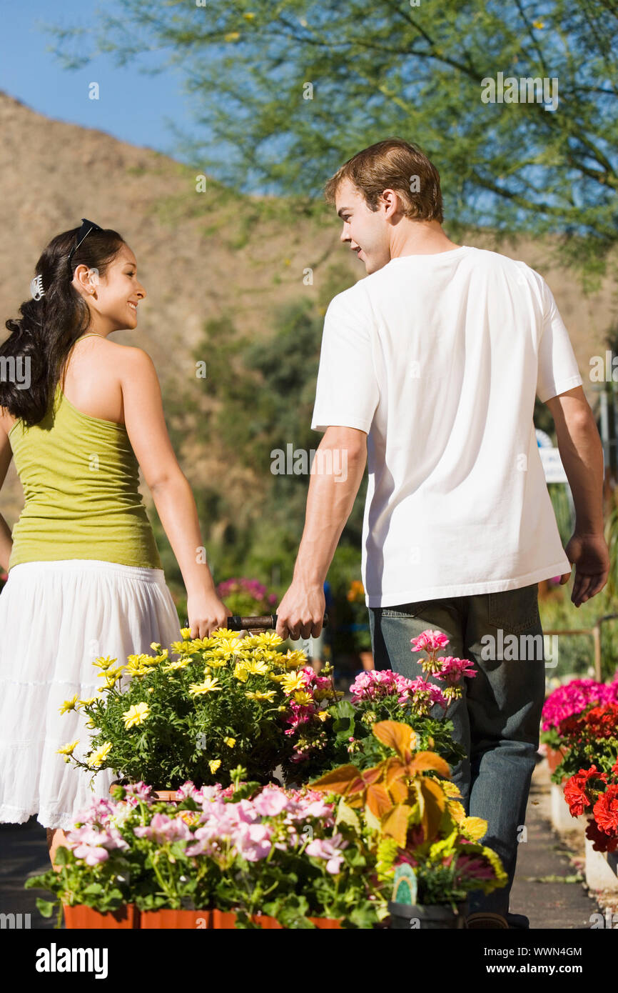 Couple cart full flowers hi-res stock photography and images - Alamy