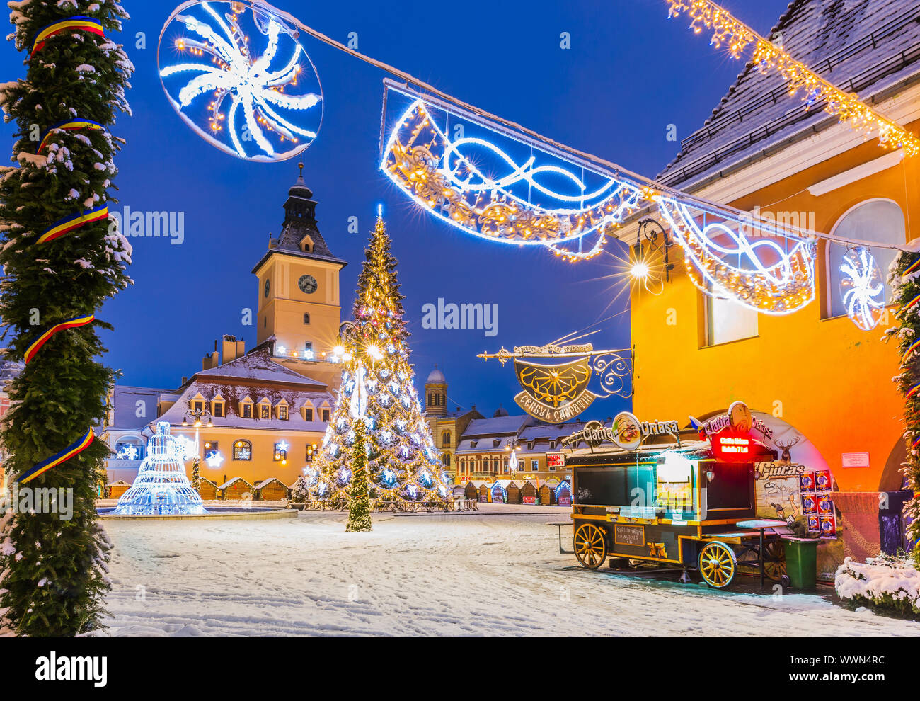 Brasov, Romania: December 18, 2018 -  Old Town Christmas Market at twilight. Stock Photo