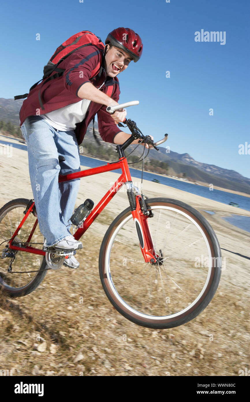 Young Man Popping Wheelie on Mountain Bike Stock Photo Alamy