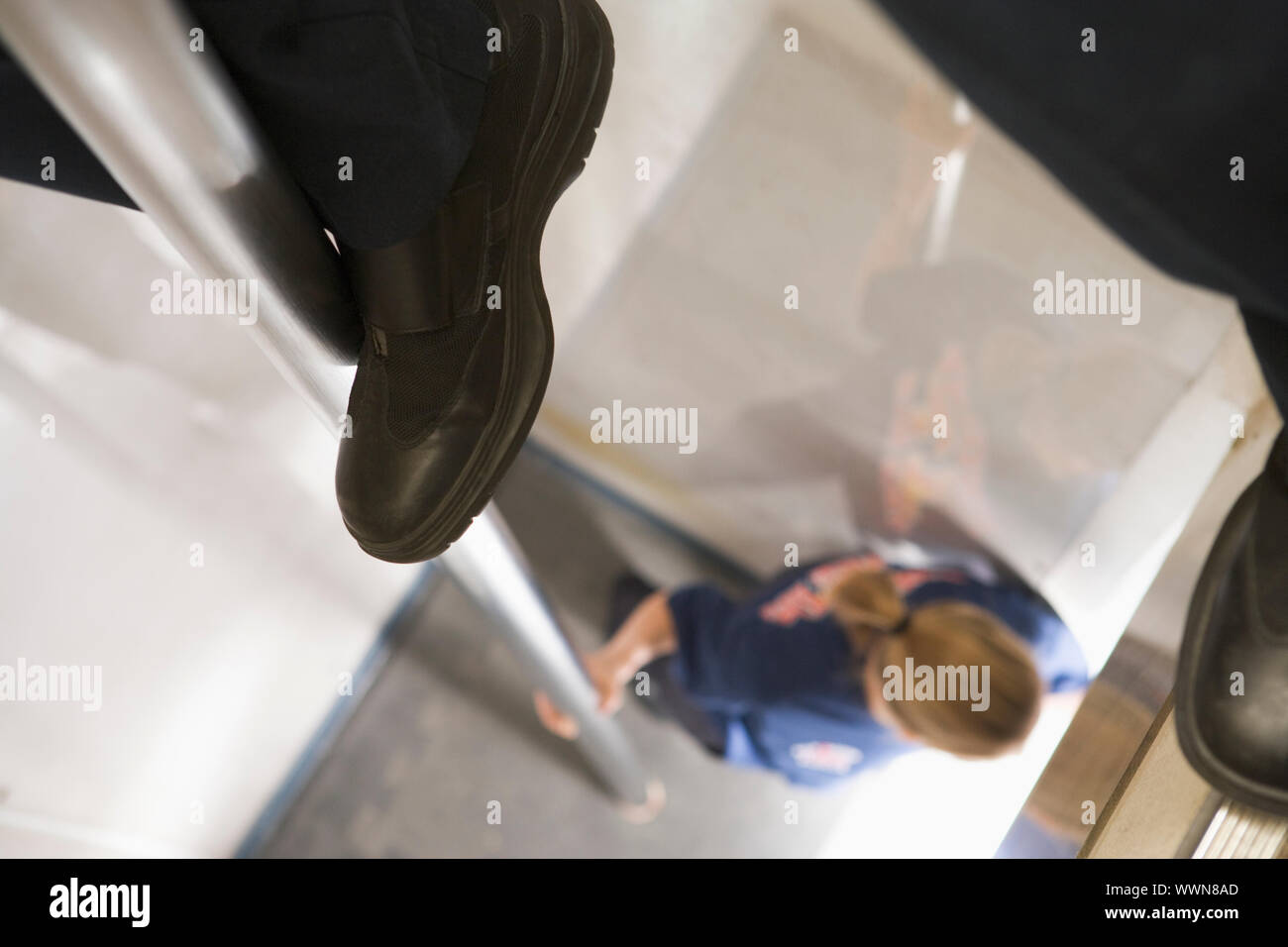 Detail of a firefighter sliding down the fireman's pole Stock Photo Alamy