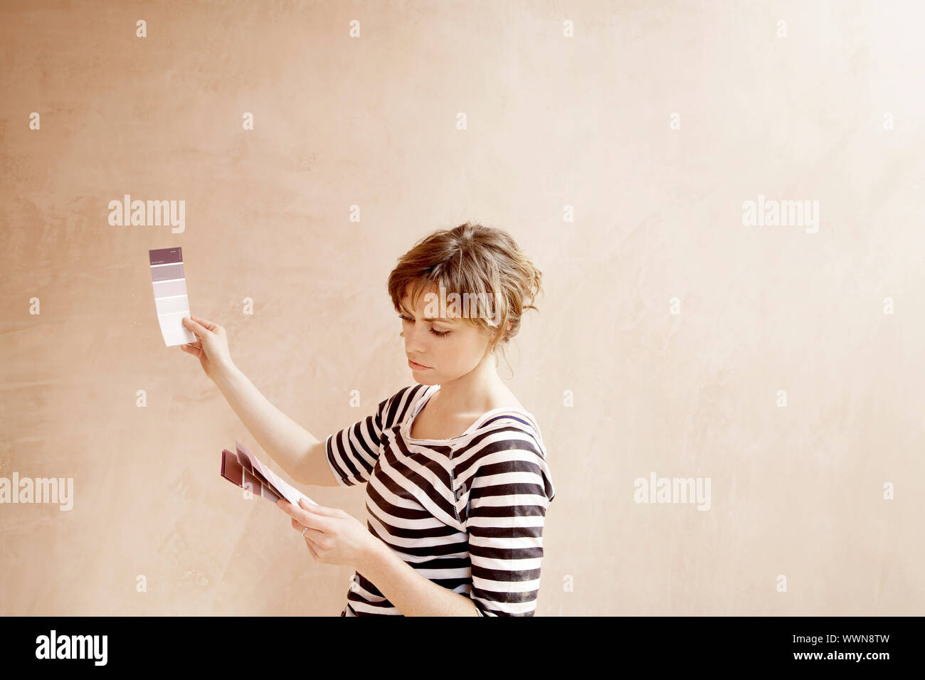 Woman Comparing Paint Color Samples Stock Photo - Alamy