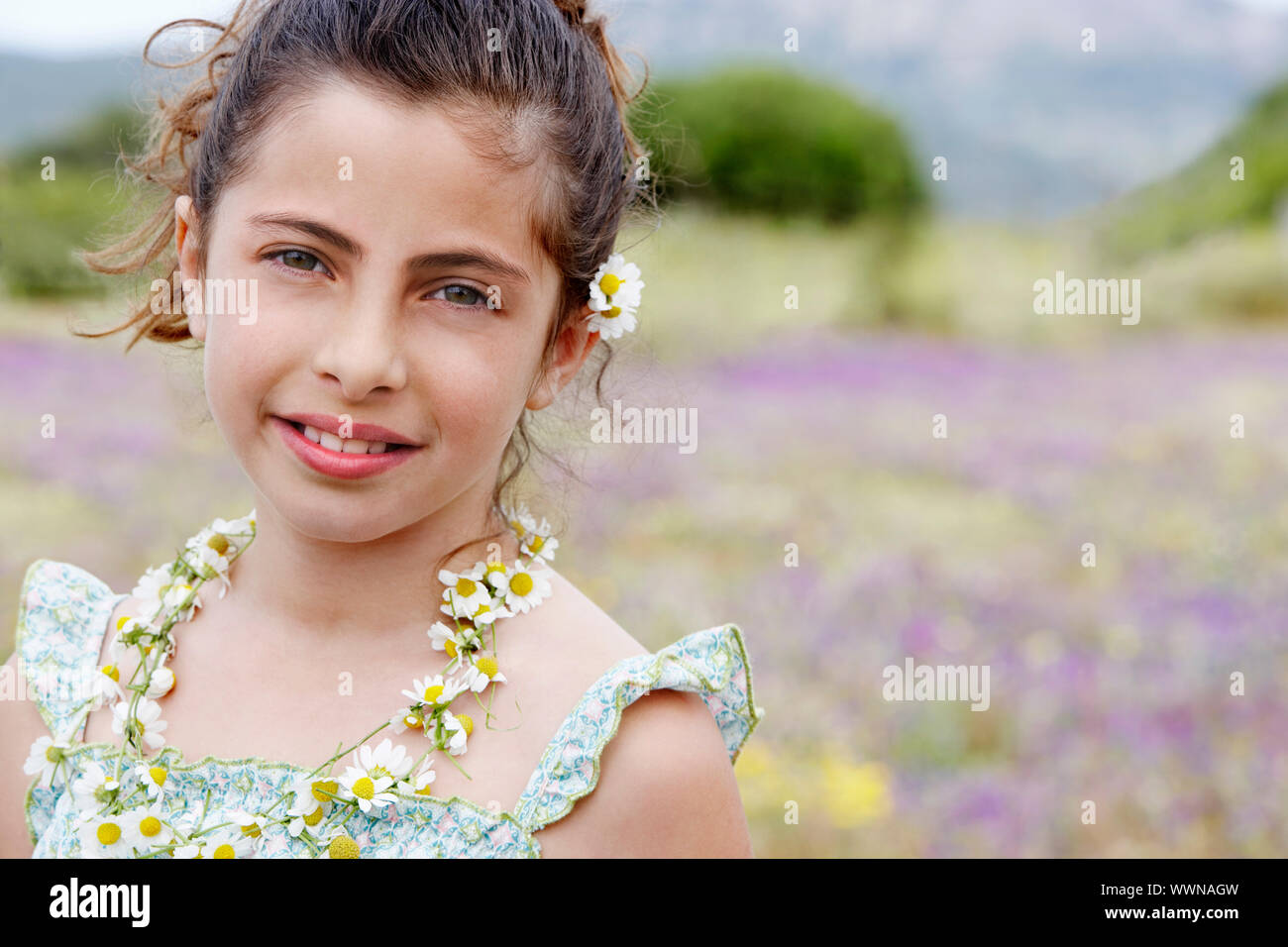 Little Girl With Flowers in her Hair Stock Photo - Alamy