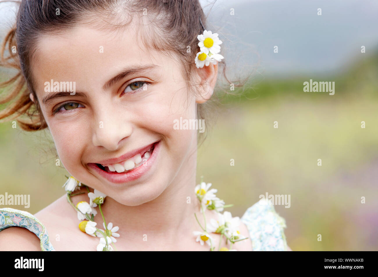Little Girl With Flowers in her Hair Stock Photo - Alamy