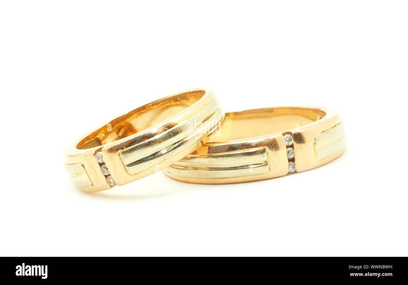 Gold wedding rings isolated on white background Stock Photo - Alamy