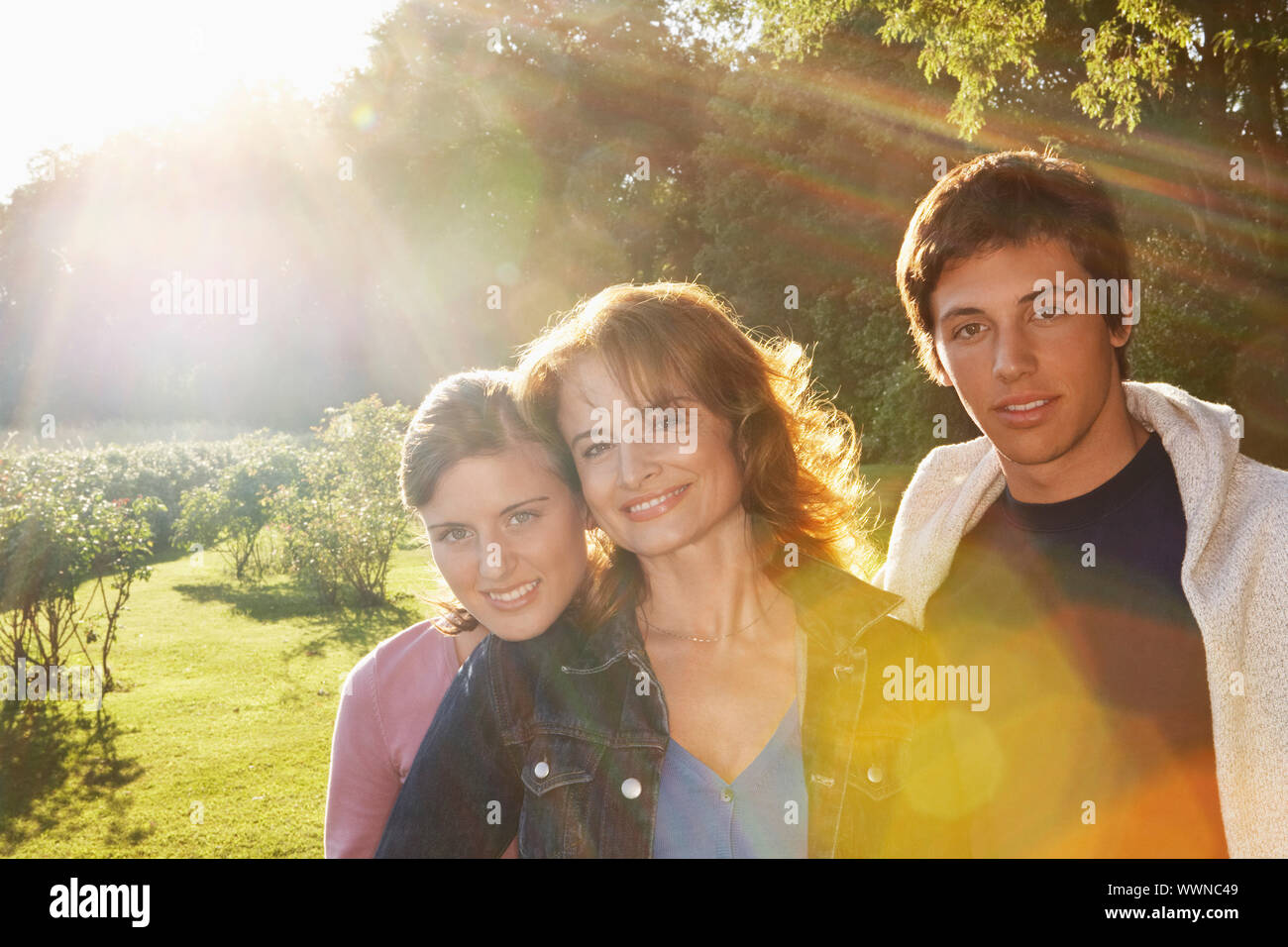 Woman Standing with her Children Stock Photo Alamy