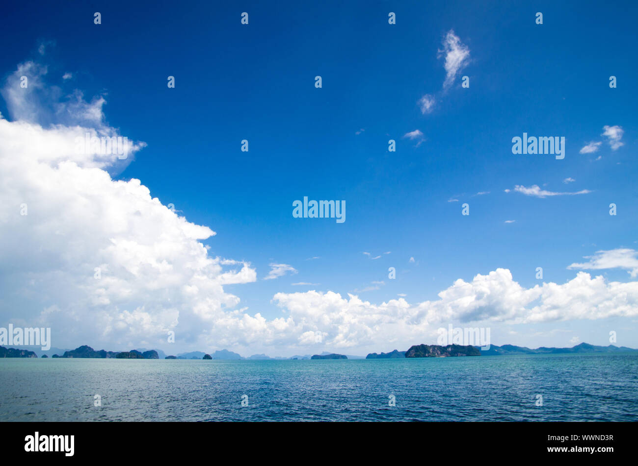 cloudy blue sky above a surface of the sea Stock Photo - Alamy