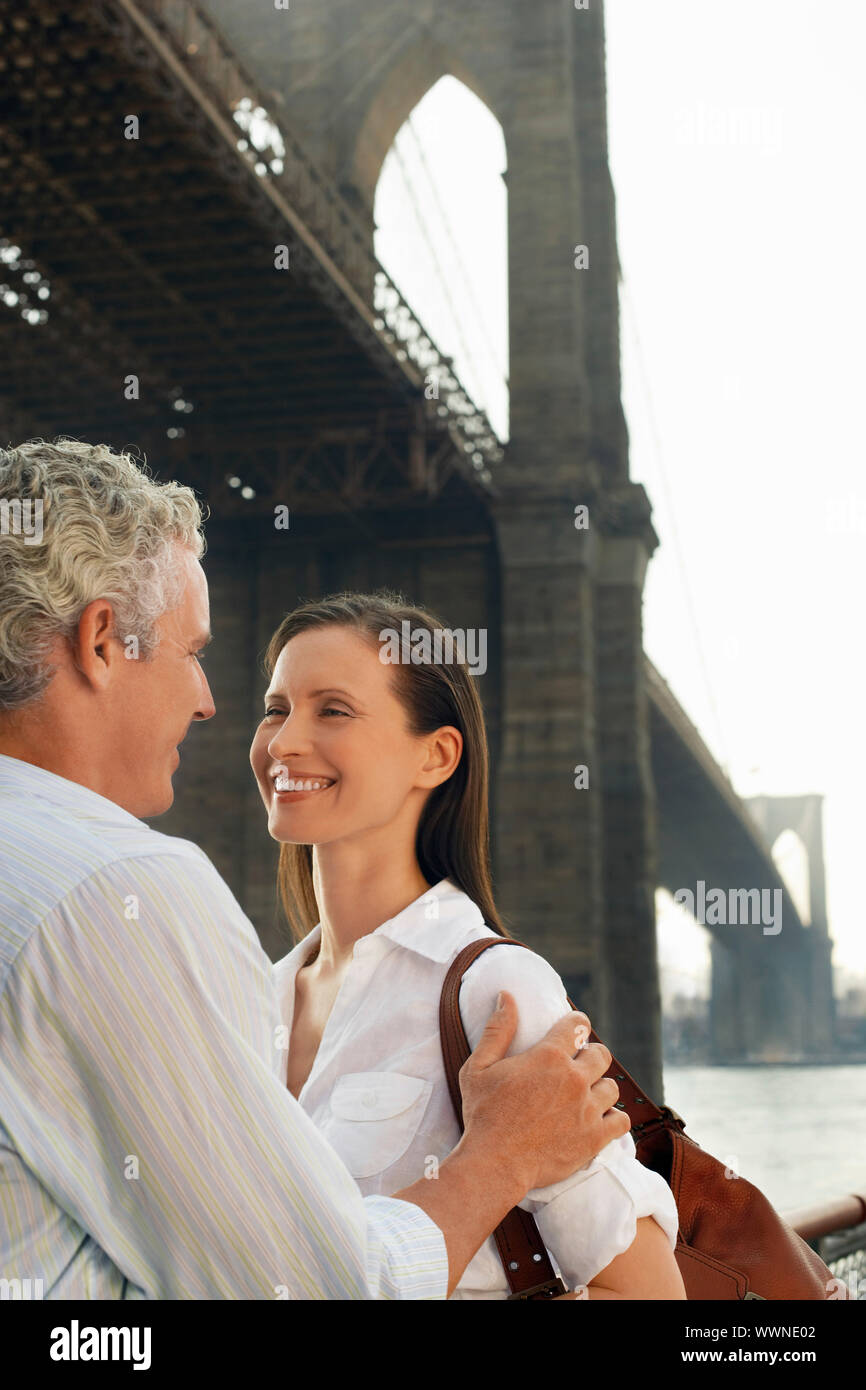 Happy Couple under Bridge Stock Photo