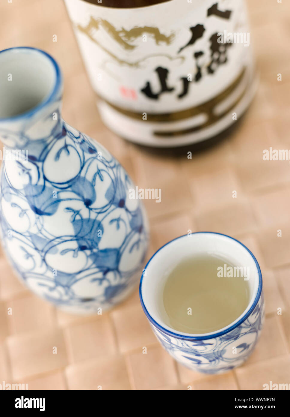 Sake Bottle Jug and Cup with bottle of sake Stock Photo Alamy