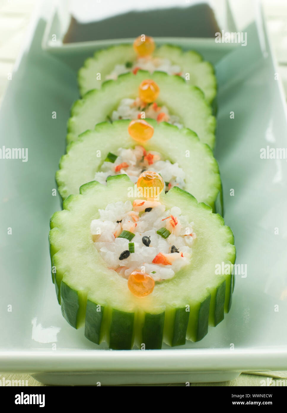 Plate of Cucumber Sushi Roll with Crayfish and a Soy Dip Stock Photo