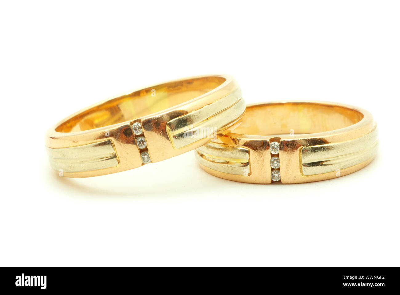 Gold wedding rings isolated on white background Stock Photo - Alamy