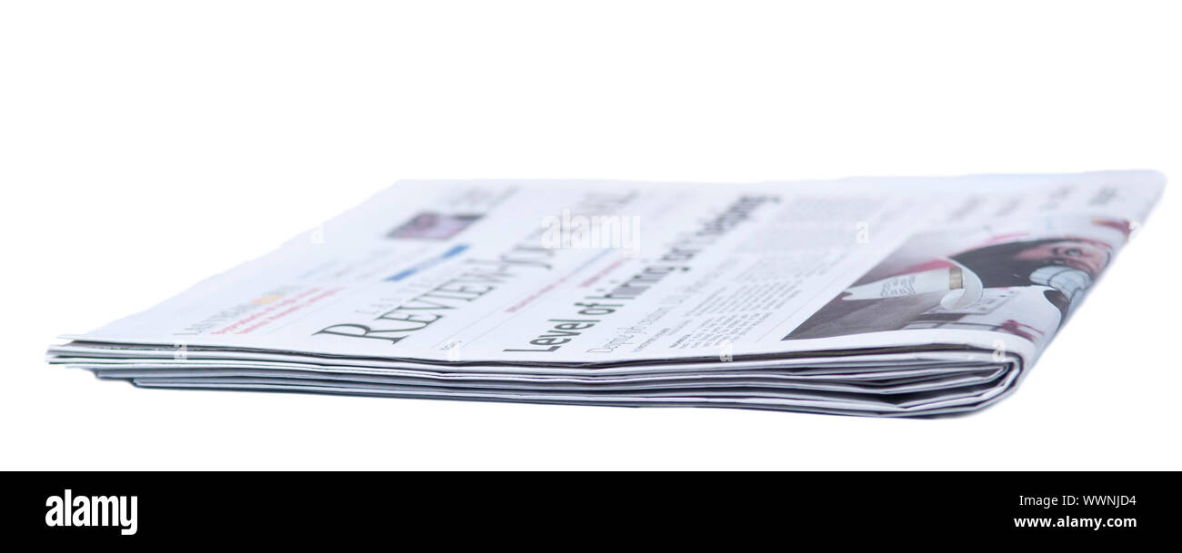 Newspaper folded on a white background Stock Photo - Alamy