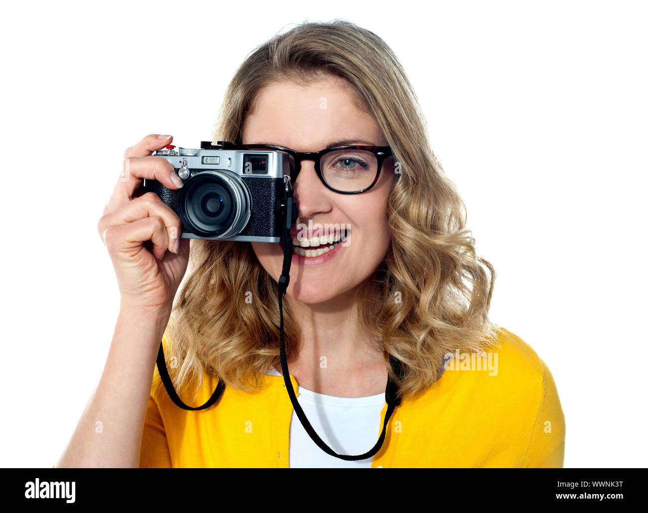 Beautiful young girl with camera, capturing an image Stock Photo