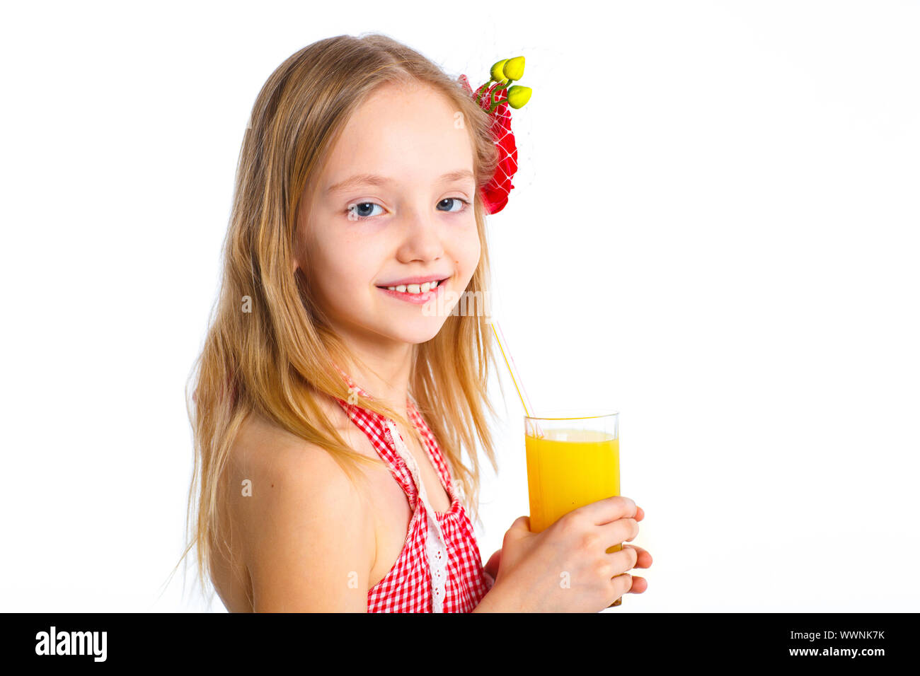 Portrait clouseup of happy little girl drinking orange juice. Isolated ...