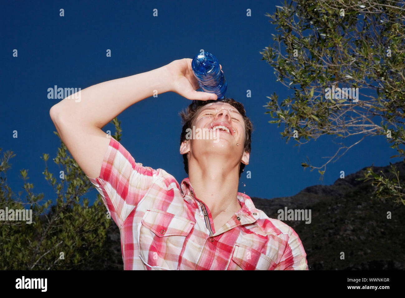 Young Man Pouring Water on Head Stock Photo Alamy