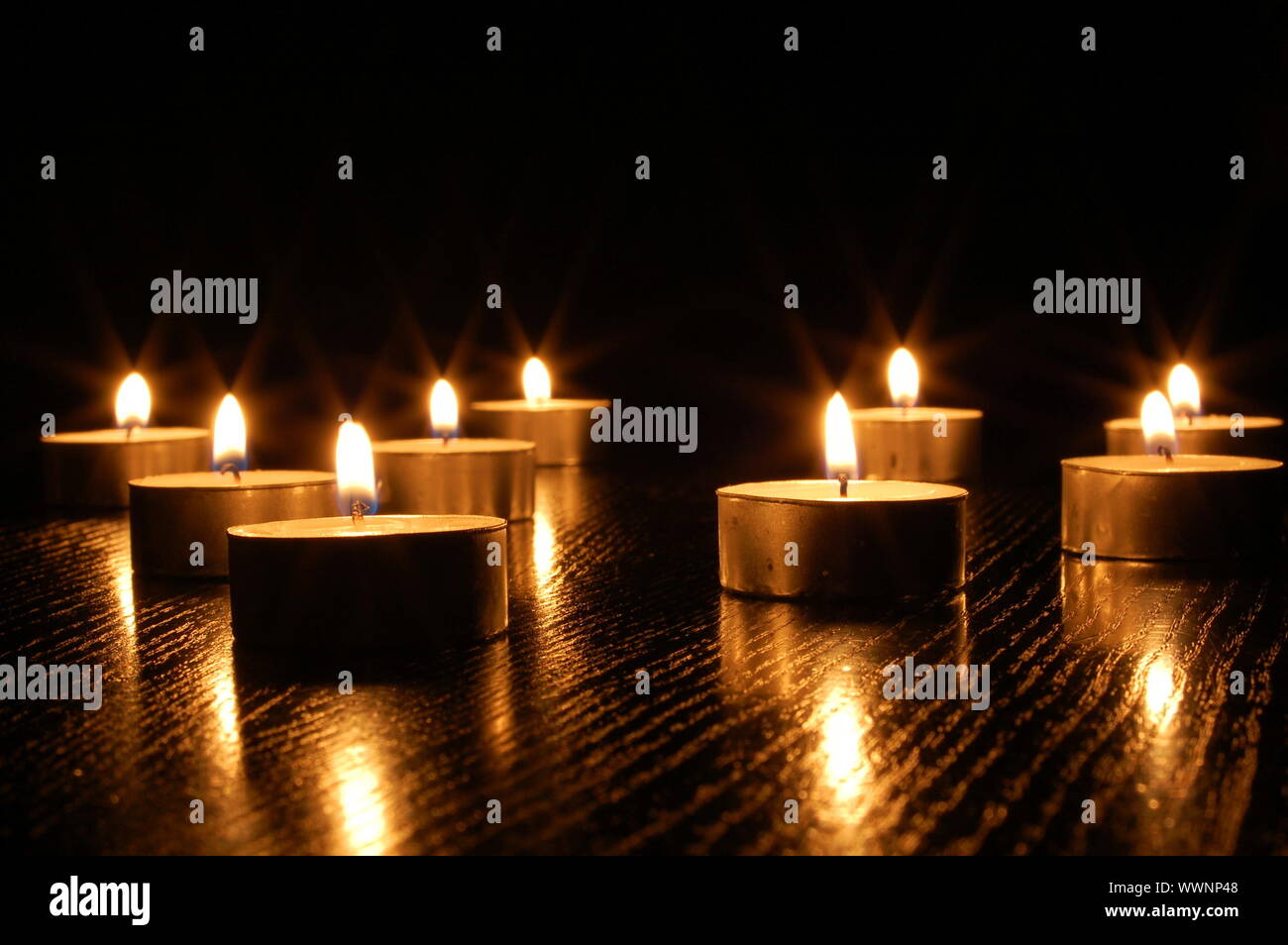 romantic candle light on a black background Stock Photo - Alamy