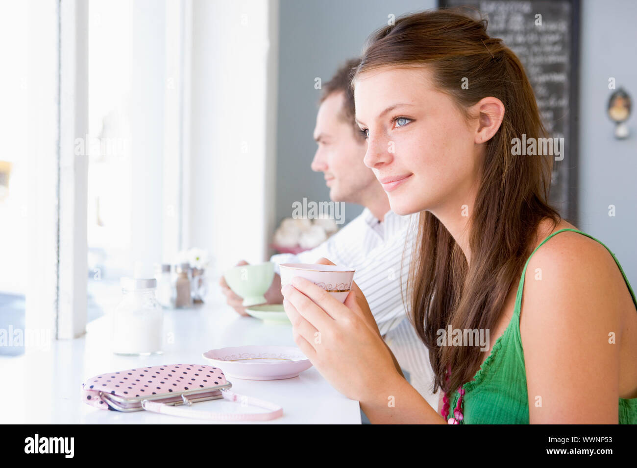 Young couple having tea in a cafeteria Stock Photo