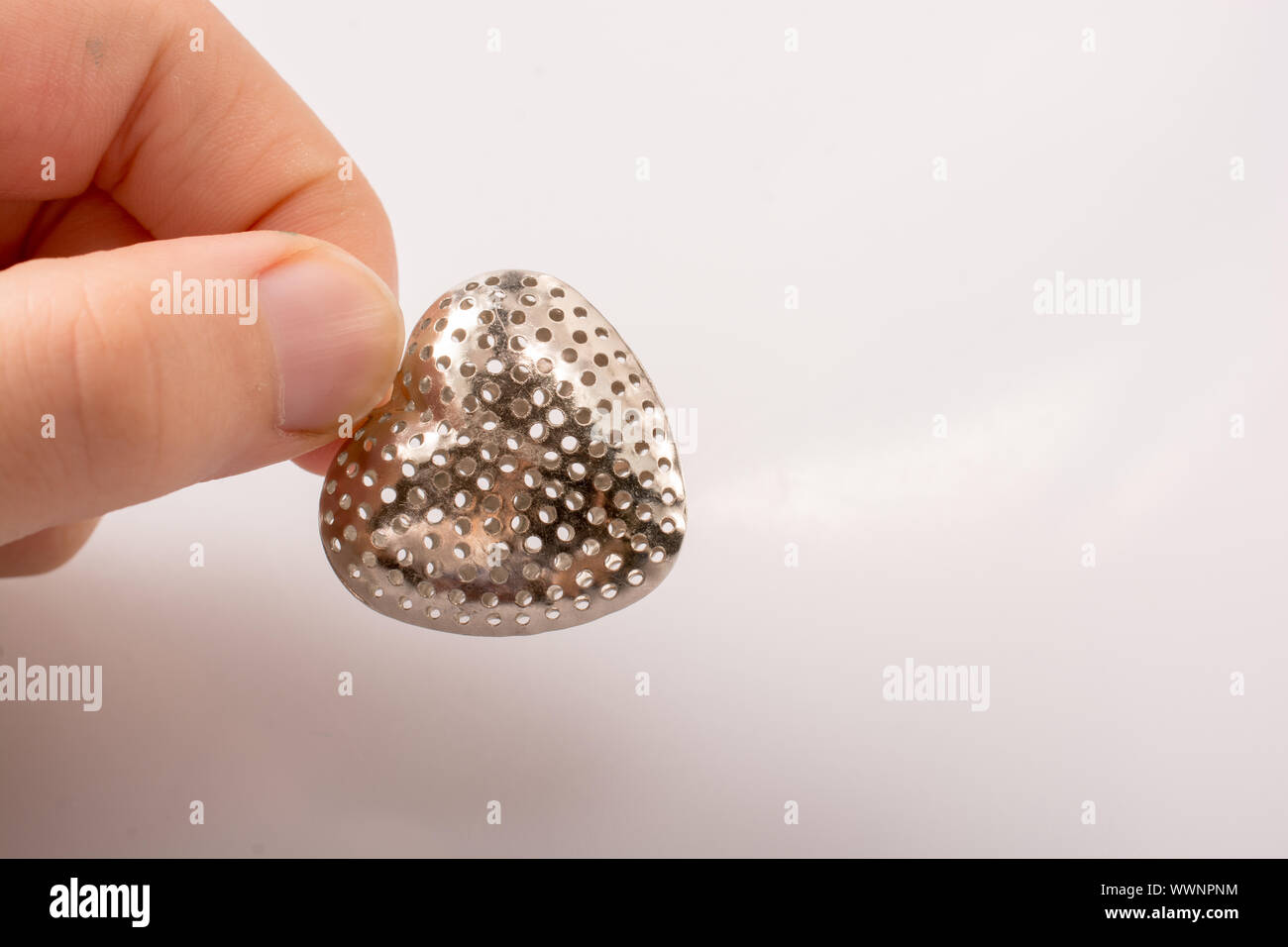Silver color metal heart icon in hand on icon on white background Stock ...