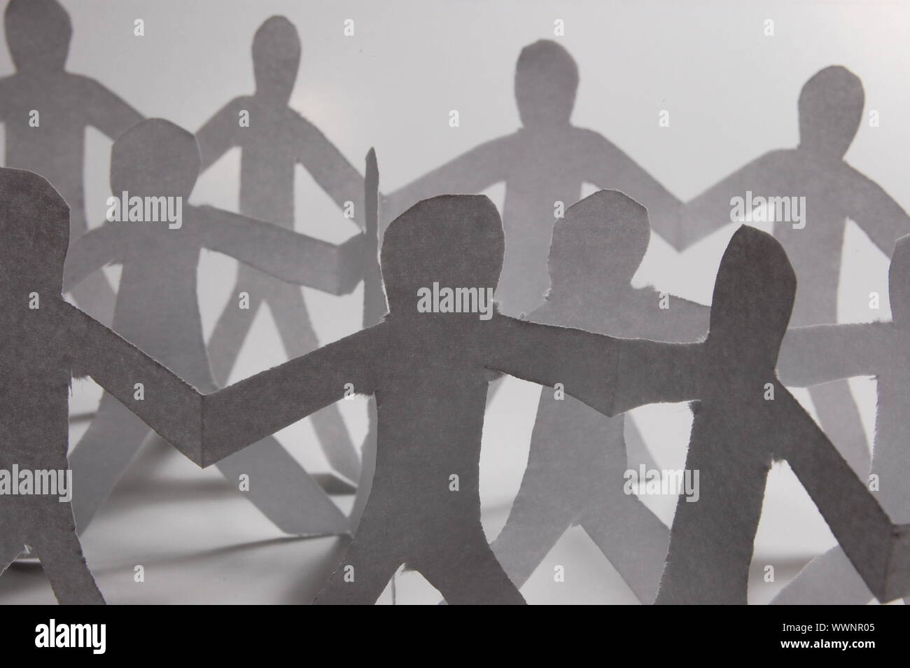 team of paper people having a party Stock Photo Alamy