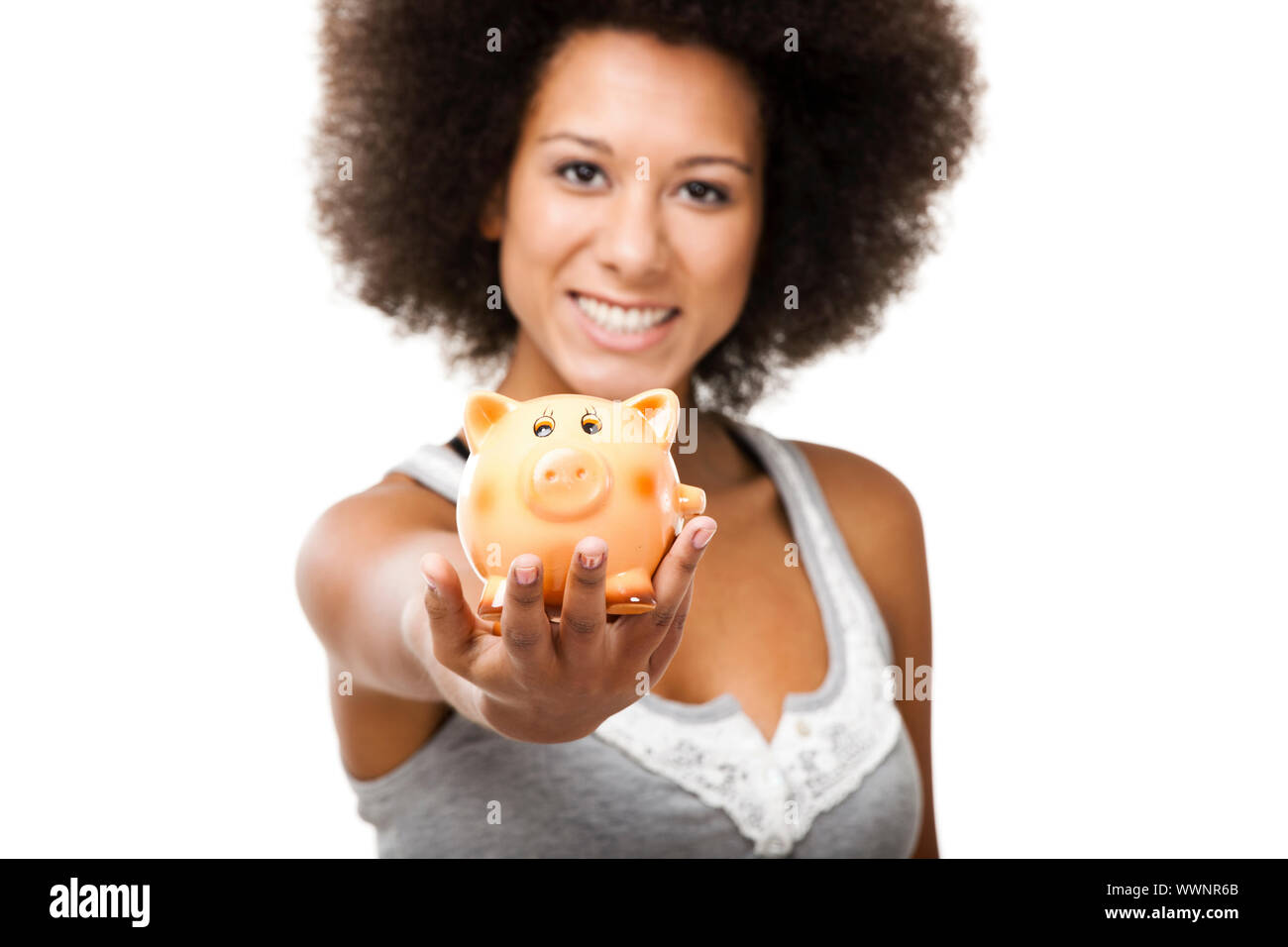 Woman holding and showing a piggy bank Stock Photo - Alamy