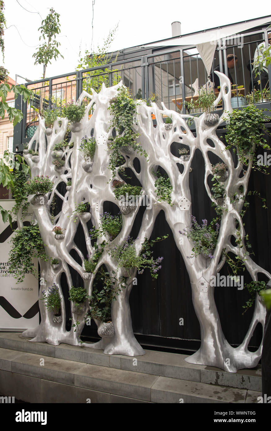 Berlin, Germany. 16th Sep, 2019. A new type of façade cladding was mounted on a wall in the inner courtyard of the Federal Centre of Competence for Culture and Creative Industries. BigRep, leading manufacturer of 3D printers, presented the world's first fully 3D printed environmental habitat for green plants and insects. It was made entirely from recycled plastic materials from PET bottles. Credit: Tom Weller/dpa/Alamy Live News Stock Photo