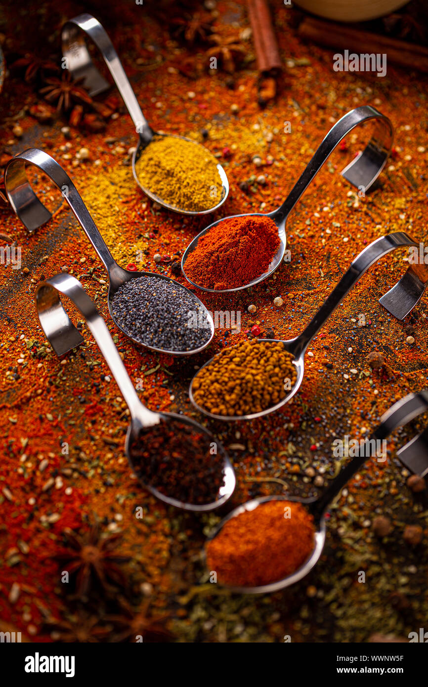 Various spices in spoons, spices and herbs composition Stock Photo