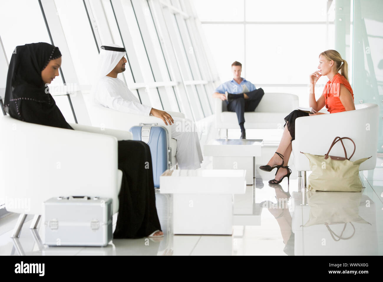 Passengers waiting in airport departure lounge Stock Photo