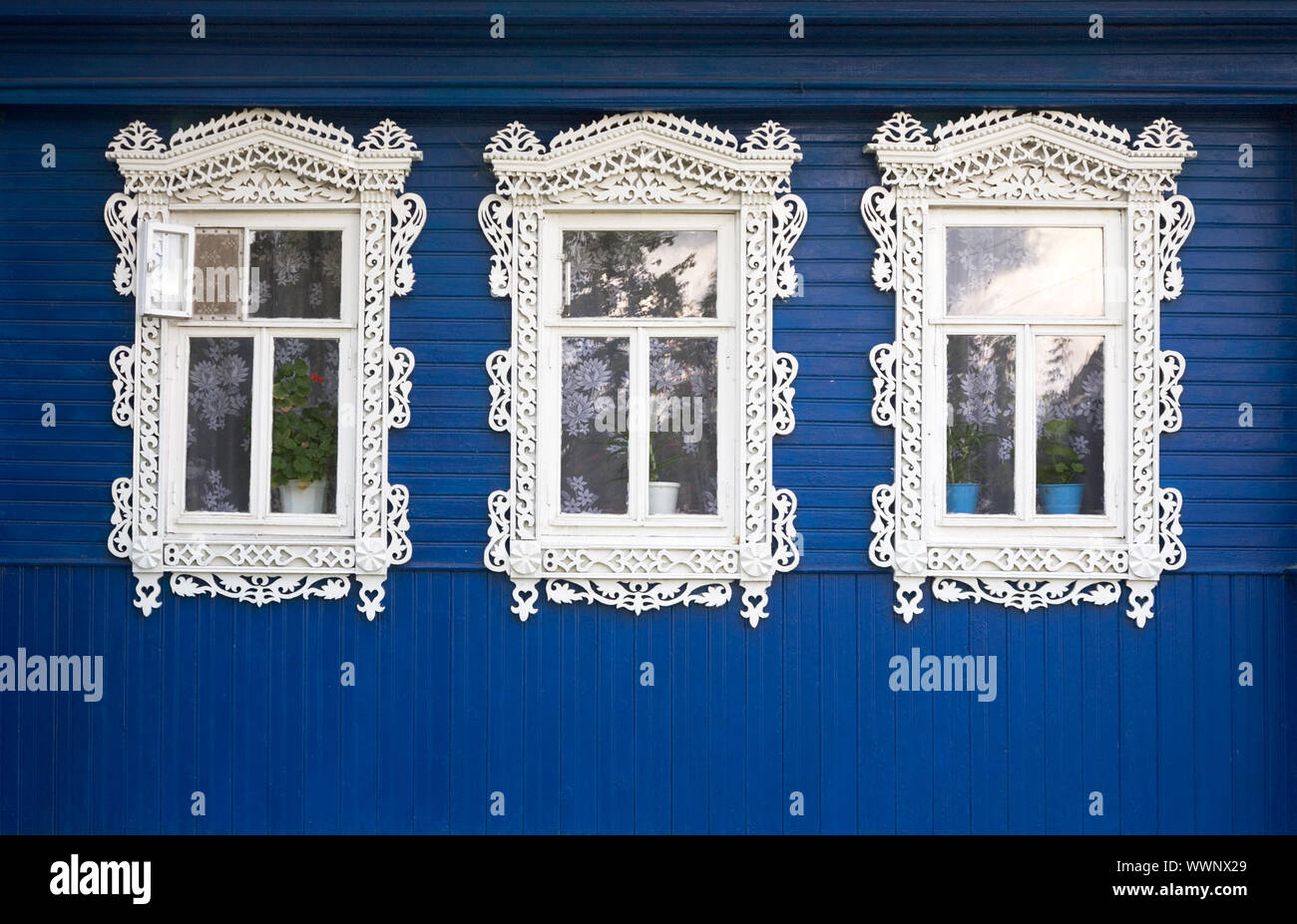 Three windows from old wooden rural wall Stock Photo - Alamy