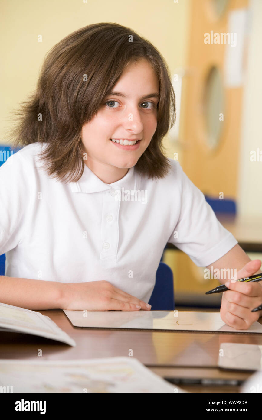 Student in class taking notes Stock Photo