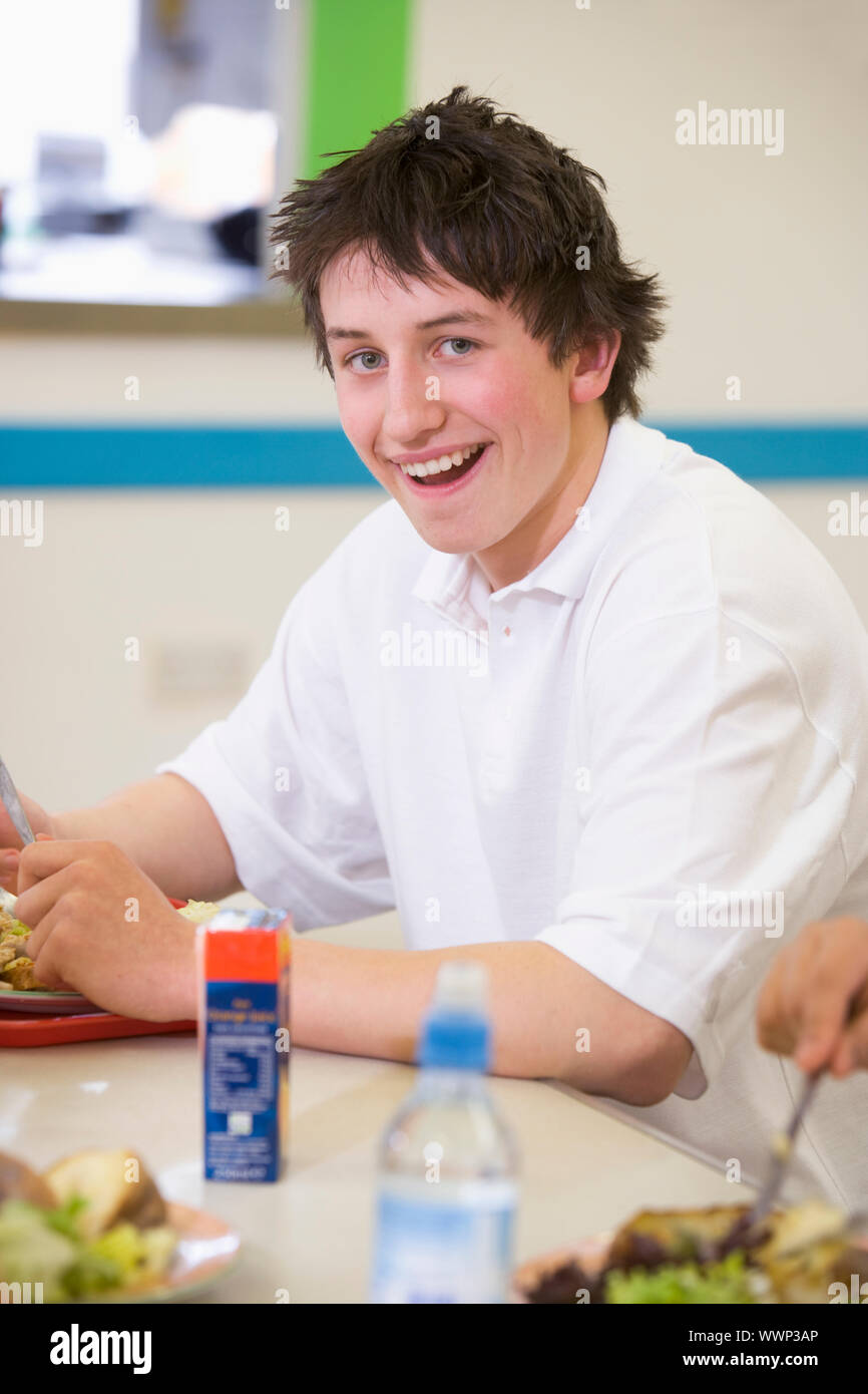 Student having lunch in dining hall Stock Photo