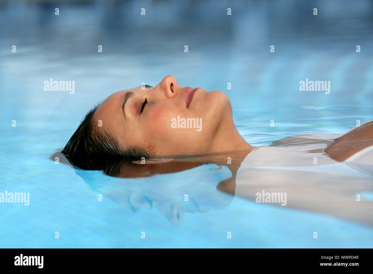 Woman lying in water Stock Photo - Alamy