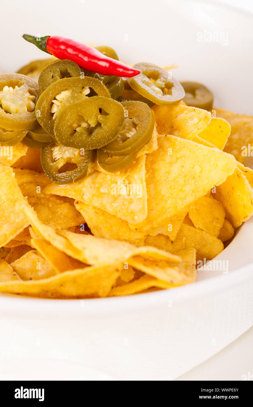 Nachos with cheese sauce and chilli pepperoni Stock Photo