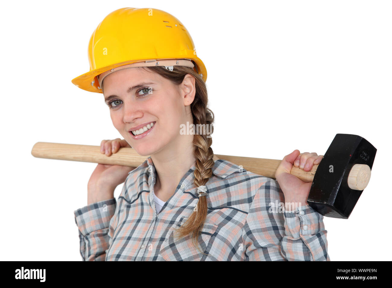 Woman holding sledgehammer over shoulder Stock Photo Alamy
