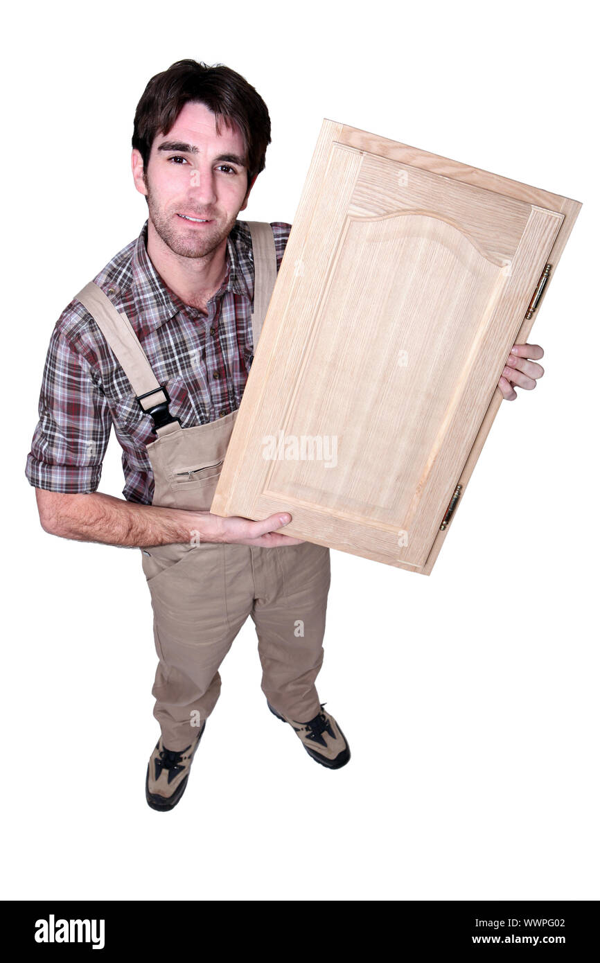 A craftsman holding up his work Stock Photo