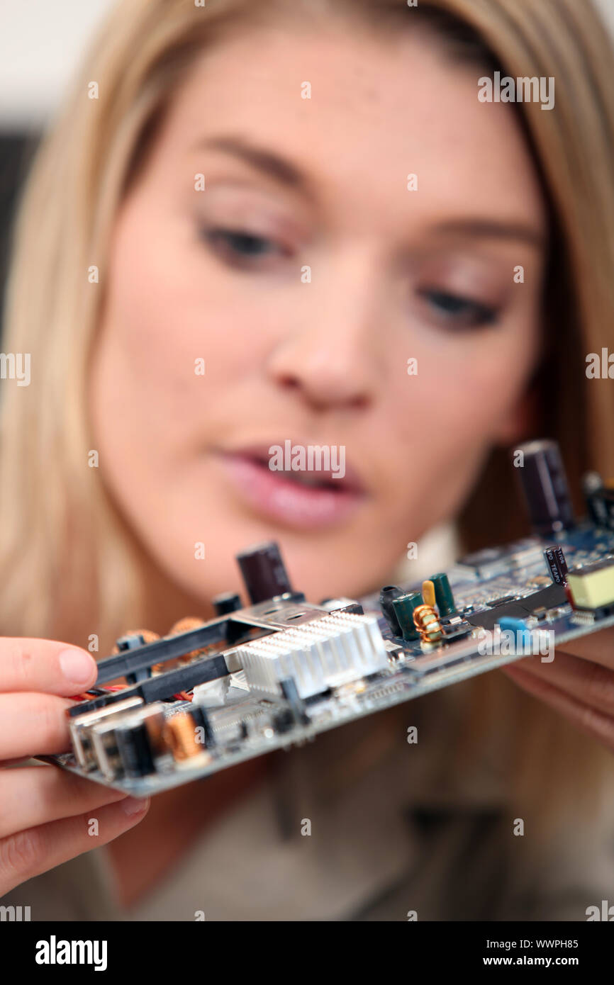 Woman fixing a motherboard Stock Photo Alamy