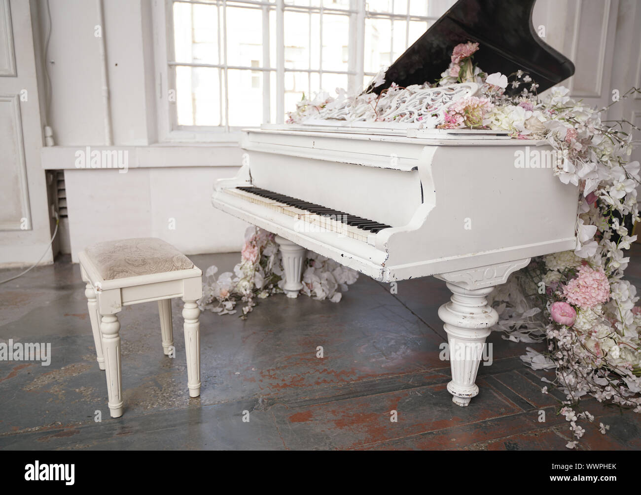 photo of a grand piano near the window with nobody here Stock Photo Alamy