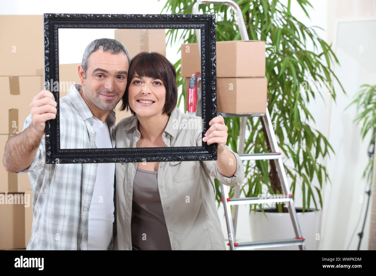 couple moving in new flat Stock Photo - Alamy