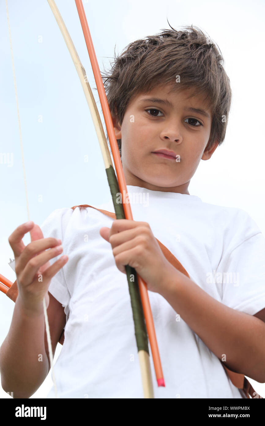 Young boy with bow and arrow Stock Photo Alamy